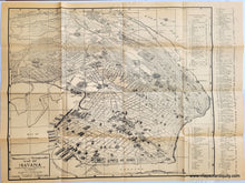 Load image into Gallery viewer, BLack and white bird's-eye view map of Havana printed on light-weight tan paper. This map was issued as a folding map and it has folds and a "cover" printed on the back