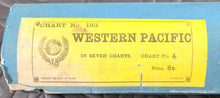 Load image into Gallery viewer, Antique chart roll with 'Western Pacific' label on a blue background
