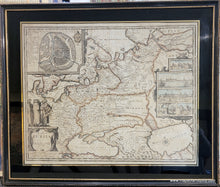 Load image into Gallery viewer, Framed antique map of Russia with decorative elements, slightly faded original color in red, orange, blue, yellow. Framing is black and gold.