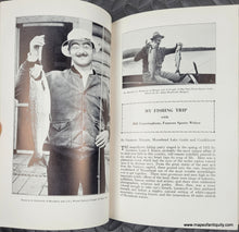 Load image into Gallery viewer, Open book with black and white photographs of a man holding a fish and text about a fishing trip.