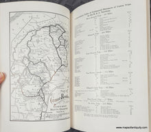 Load image into Gallery viewer, Open book with a map and list of canoe trips in Maine's North Country