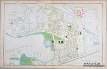 Load image into Gallery viewer, ANtique map of part of wakefield showing streets and buildings with original hand-coloring in tones of yellow, green, pink, and blue.