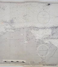 Load image into Gallery viewer, Old sailing chart of the Venezuela coast with the islands of trinidad, tobago, tortuga. Black and white with small bits of color to indicate lighthouses/buoys