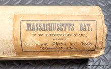 Load image into Gallery viewer, antique chart rolled showing the beige fabric backing and label of distributor from the 1880s
