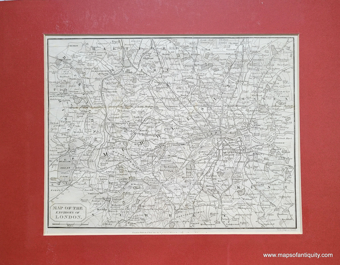 Antique map with London in the middle-right center area and the surrounding towns and villages labeled with roads, parks, canals, and more. Black and white. Matted with a red mat.