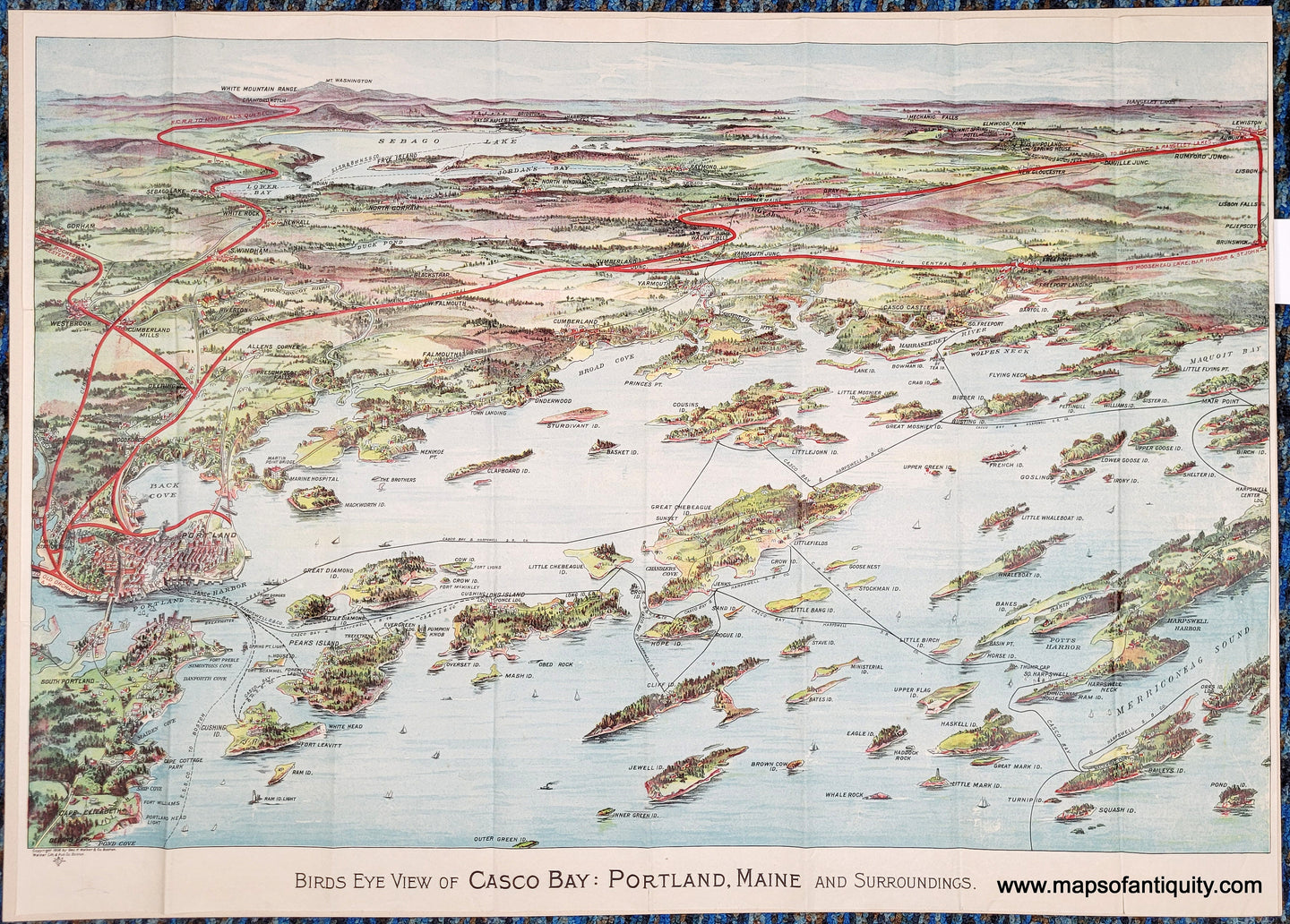 Antique bird's-eye view of part of Casco Bay in Maine with chromolithograph colors in blues, greens, reds, and purples. Red lines show the train routes. Black lines show ferry routes. Portland is on the left side and Mount Washington is in the distance. The islands of Casco Bay are in the foreground.