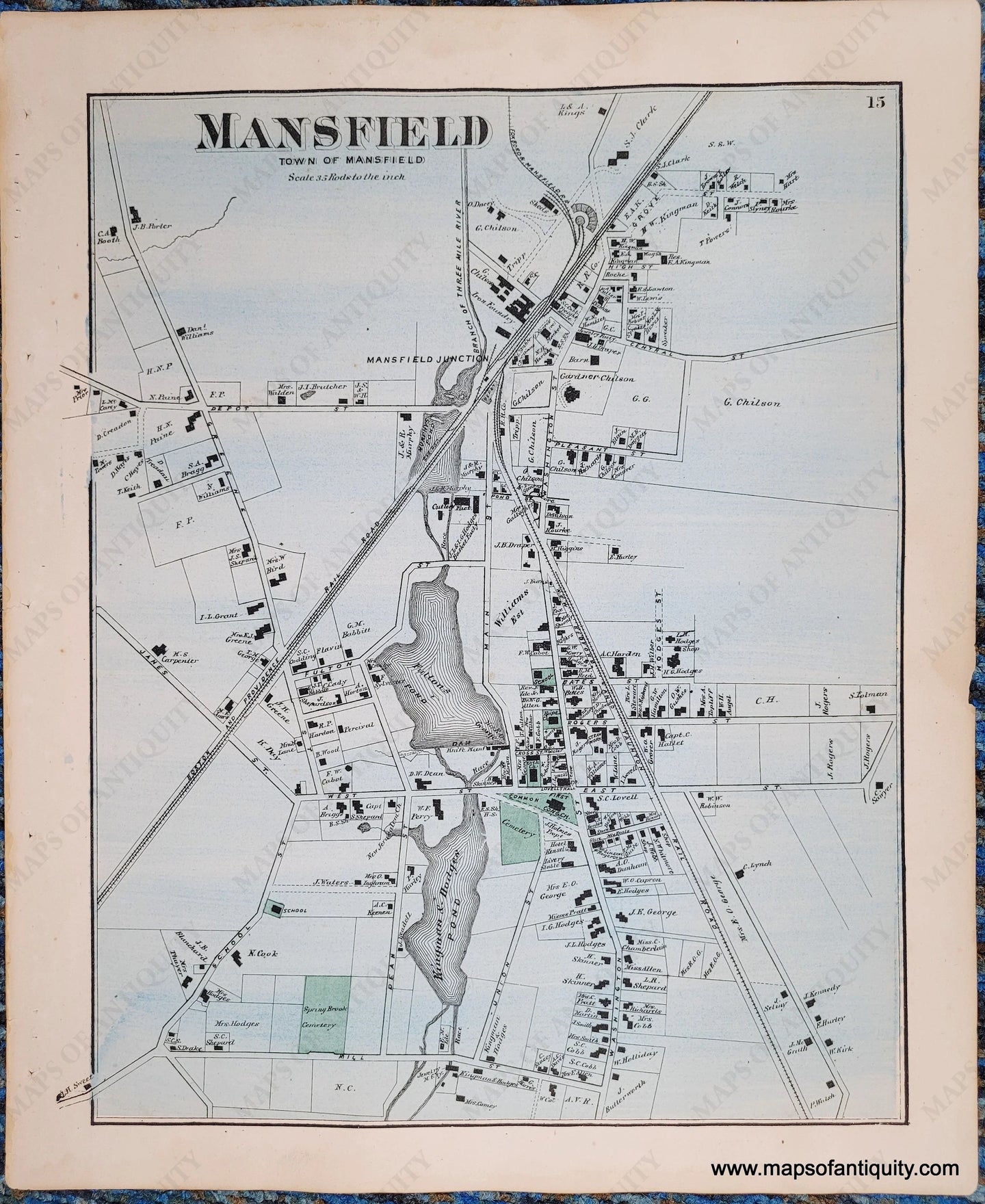 Antique map of the center of Mansfield, Massachusetts with original hand-coloring. Overall light blue color with green at cemeteries, commons, schools.