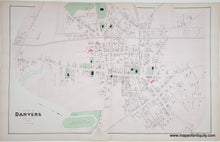 Load image into Gallery viewer, Antique street map of Danvers, Massachusetts, on aged beige paper with fine black lines, green park areas, and a few small pink highlights. The title 'Village of DANVERS' is printed in the lower-left corner.
