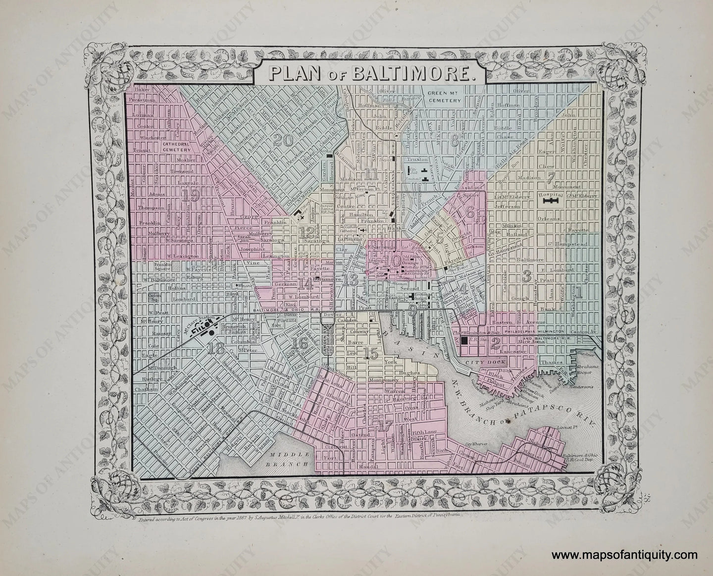 Antique map of the center of Baltimore in tones of pink, yellow, green, and blue.