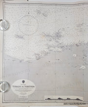 Load image into Gallery viewer, Old sailing chart of the Venezuela coast with the islands of trinidad, tobago, tortuga. Black and white with small bits of color to indicate lighthouses/buoys
