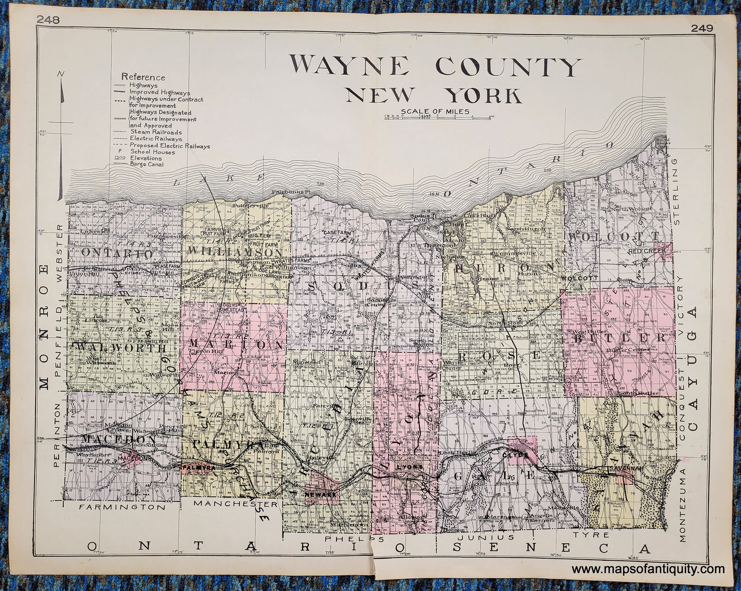 Antique map of Wayne County New York, NY, colored by town in antique tones of pink, green, yellow, purple, and showing railroads, highways, proposed highways, cities, villages, etc. Published in 1911.