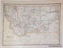 Load image into Gallery viewer, Antique map of Montana with original printed color. The color indicates the county borders and is in antique tones of green, pink, orange, yellow, and blue.
